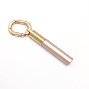 Scrivener's Tools Pen Carabiner in Gold with Tom's Studio Field Mouse pen in Blush attached via brass loop lid