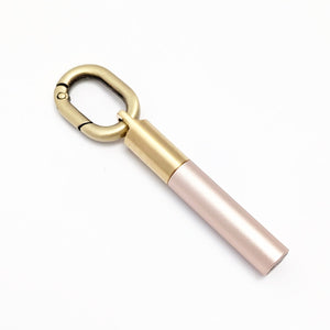 Scrivener's Tools Pen Carabiner in Bronze with Tom's Studio Field Mouse pen in Blush attached via brass loop lid