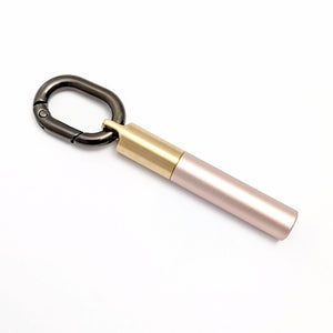 Scrivener's Tools Pen Carabiner in Gunmetal with Tom's Studio Field Mouse pen in Blush attached via brass loop lid