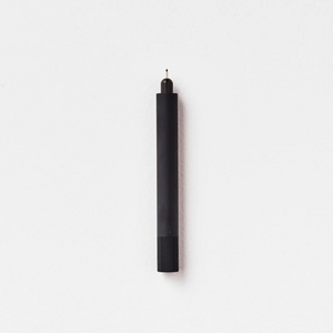 Tom's Studio Lumos Mini refillable pen in Black, cap posted with tip exposed, on white background