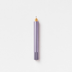 Tom's Studio Lumos Mini refillable pen in Lilac (soft purple), cap posted with tip exposed, on white background