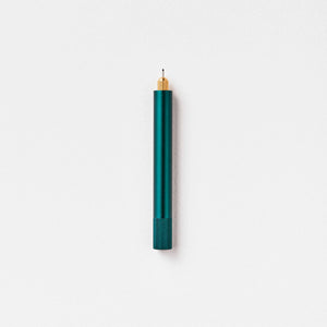 Tom's Studio Lumos Mini refillable pen in Ivy (dark green), cap posted with tip exposed, on white background