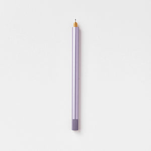 Tom's Studio Lumos Pro Single in Lilac (pale purple), fineline tip exposed, cap posted, on textured paper