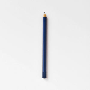 Tom's Studio Lumos Pro Single in Midnight (dark navy), fineline tip exposed, cap posted, on textured paper